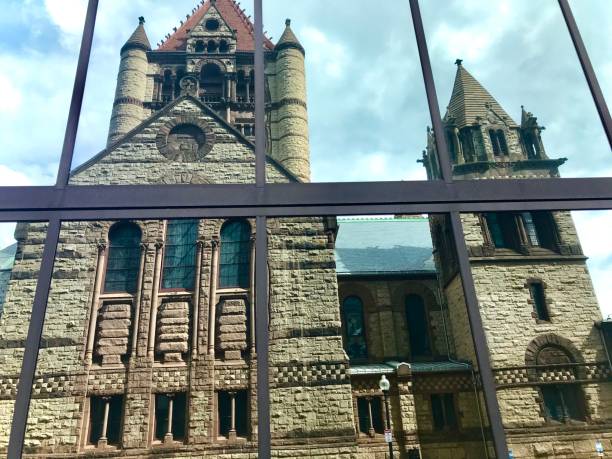istock Old Stone Church Reflected in Modern Glass Tower 1269954051