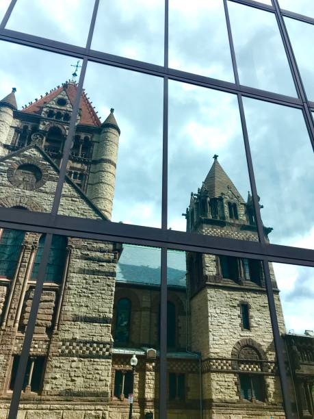 istock Old Stone Church Reflected in Modern Glass Tower 1269954061