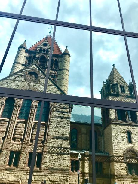 istock Old Stone Church Reflected in Modern Glass Tower 1269954067
