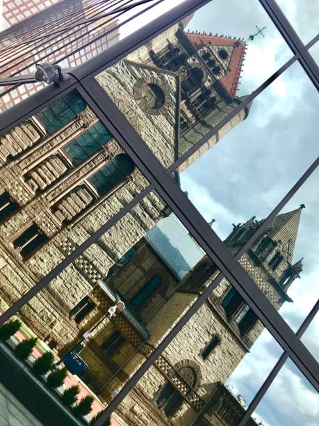 istock Old Stone Church Reflected in Modern Glass Tower 1269954086