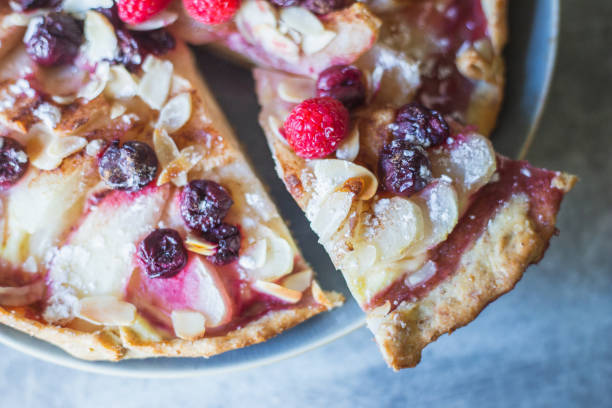 istock Galette with pear, berries, almonds close-up shot from above 1269957508
