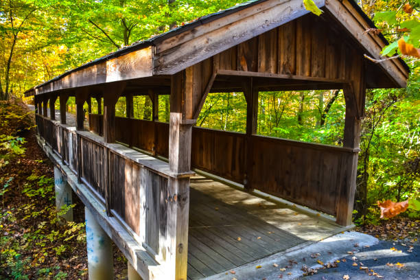 istock A covered walking bridge spans the creek 1269961575