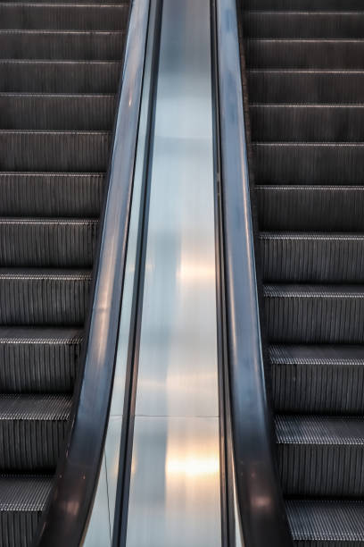 istock Close up of empty steps of an escalator in a perspective view. 1269961660