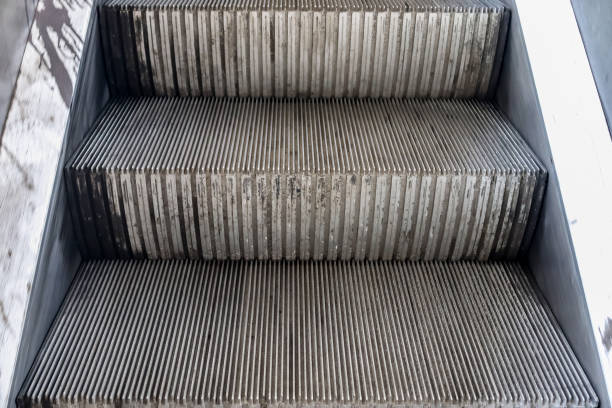 istock Close up of empty steps of an escalator in a perspective view. 1269961678