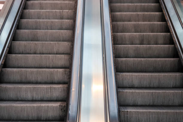 istock Close up of empty steps of an escalator in a perspective view. 1269961682
