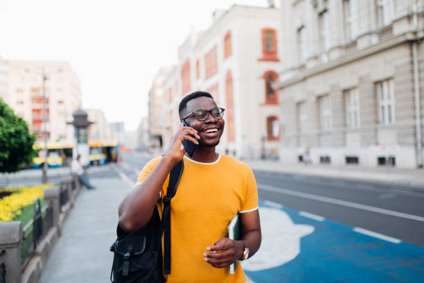 istock Young African American man talking on his smart phone 1269963395