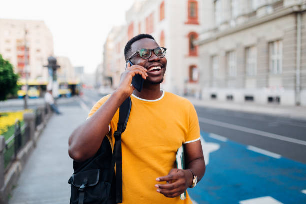 istock Young African American man talking on his smart phone 1269963418