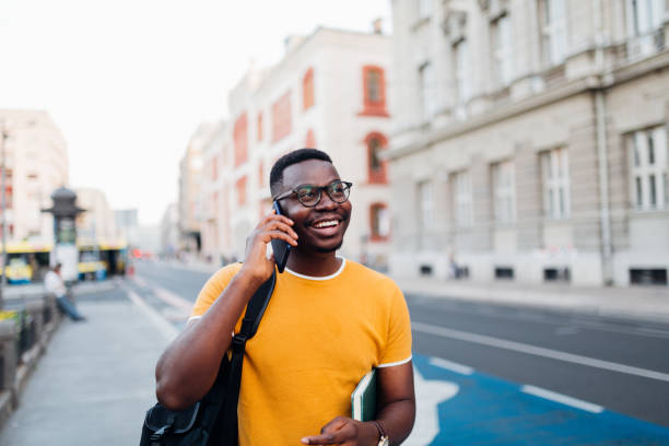 istock Young African American man talking on his smart phone 1269963426