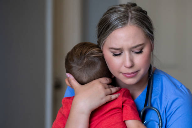 istock Nurse mother hugs toddler son before leaving for work 1269965583