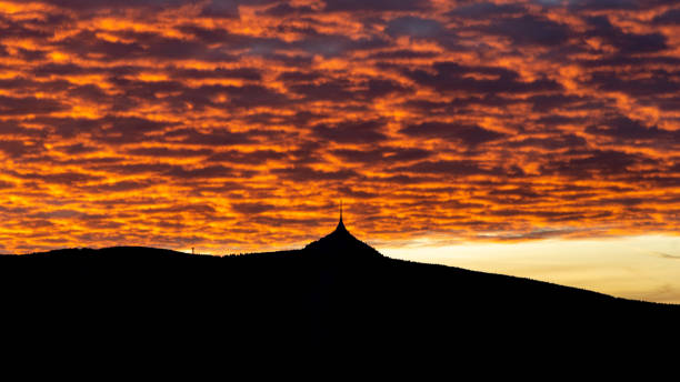 istock Silhouette of Jested mountain at sunset time with beautyifully illuminated evening sky, Liberec, Czech Republic 1269965857