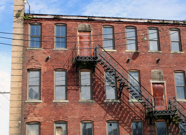 istock Old, Uninhabited Brick Apartment Building in Downtown Area 1269966238