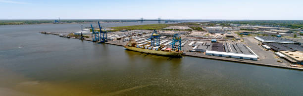 istock A container ship loading in a port. Aerial stitched panorama. 1269966920