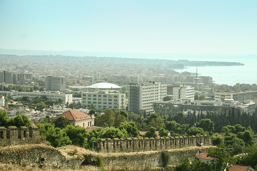 Picture of the panorama of Thessaloniki seen from above, in Ano Poli, greece. Thessaloniki's Upper Town called Ano Poli is the old town of Thessaloniki and is located around the city's acropolis north of the city center. The neighborhood is known for its well preserved Byzantine and Ottoman era structures and urban design