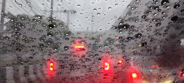 istock Heavy rain and traffic with car light 1269970472