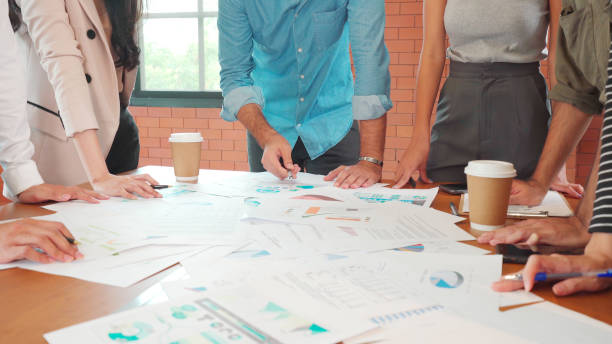 istock Close up hands of office people discuss and brainstorm over paperwork 1269972145