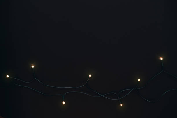 istock Golden Christmas garland on black background. 1269985715