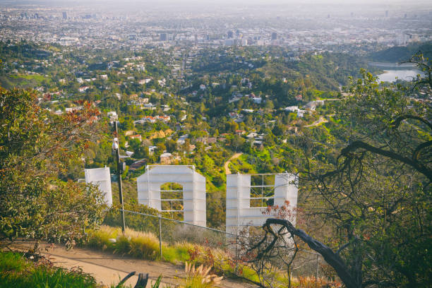 Famous touristic attraction an iconic Hollywood Sign overlooking Los Angeles. Los Angeles, Famous touristic attraction an iconic Hollywood Sign overlooking Los Angeles. Los Angeles, California/USA - April 8, 2018 griffith park observatory stock pictures, royalty-free photos & images