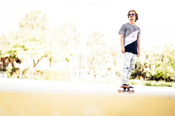 istock Millenial guy skateboarding with sunglasses 1269989906