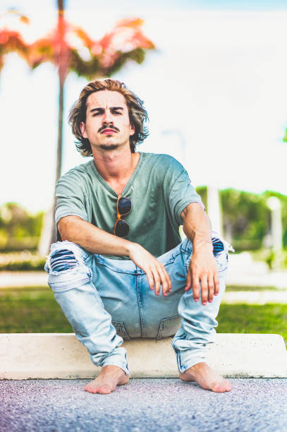 istock Millenial age guy with cool attitude barefoot 1269990869