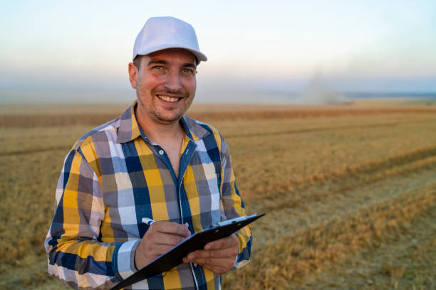 istock Agriculture: Farmer or rancher with Computer in a Wheat Field 1269992610