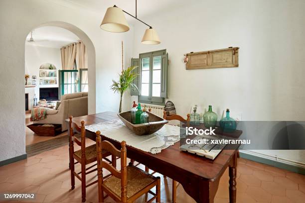 Dining Room With View Into Living Room In Spanish Home Stock Photo - Download Image Now
