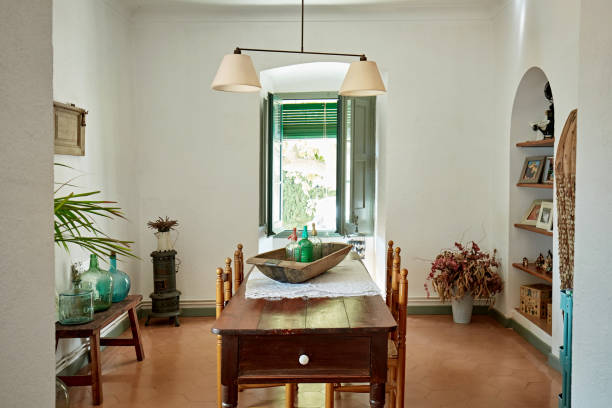 istock Dining Room Table and Open Window in Spanish Home 1269998510