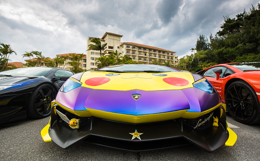 On 02/11/2017 on the Kaichudoro of Okinawa, Japan a Lamborghini customized with Pikachu decals is parked at a resort car park.