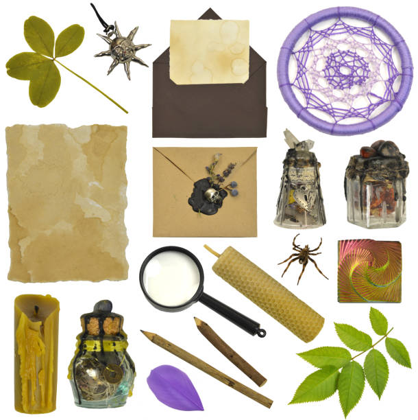 Design set with magic witch bottles, four-leaf clover, candle and hand crafted envelopes. Mystic Halloween concept.