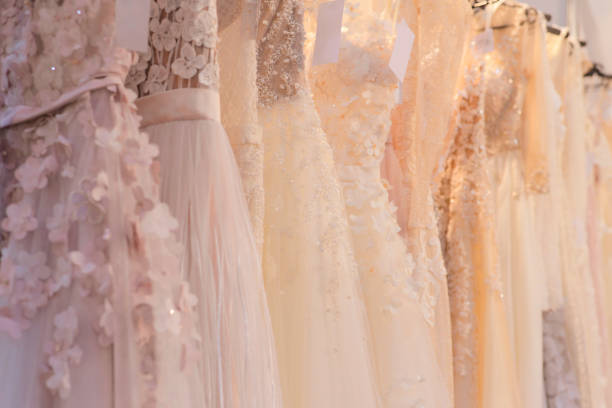 istock Wedding dresses hang on a hanger in a row 1270007287