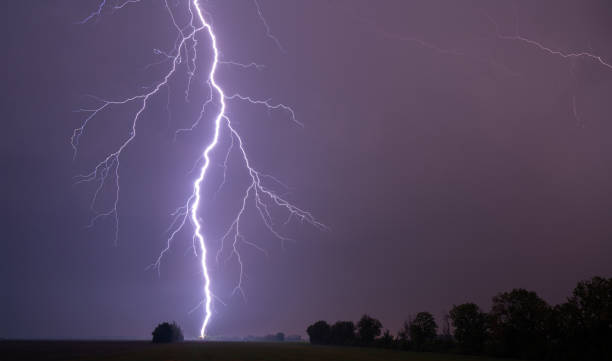 istock beautiful lightning on night sky over rural landscape 1270007288