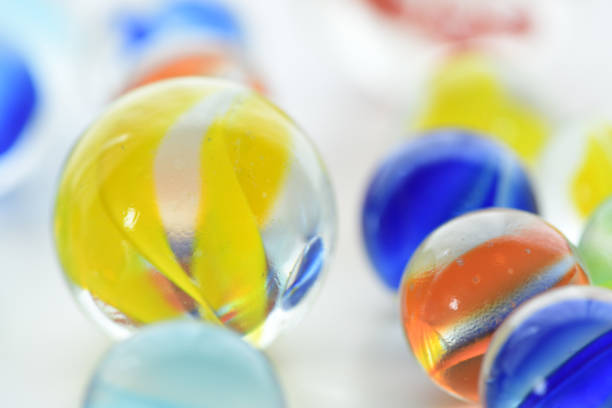 istock Colorful glass marbles on white background. 1270007318