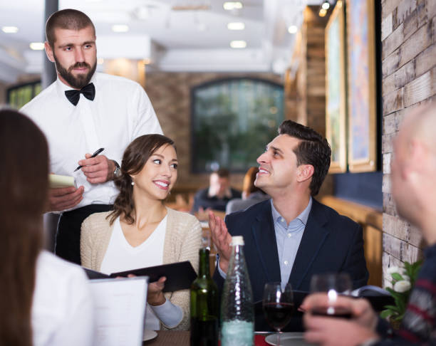 istock Employee waiter man taking order from guests 1270007697