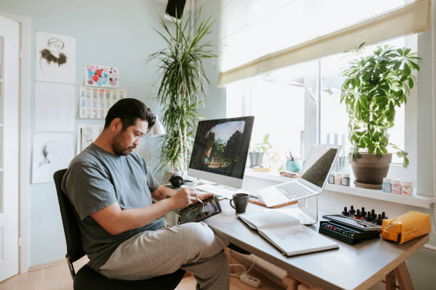 istock Digital artist drawing on digital table in his home studio 1270008678