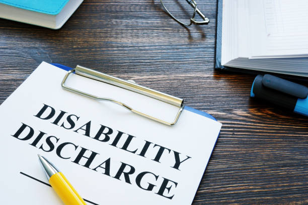 istock Disability discharge application papers and pen. 1270011286