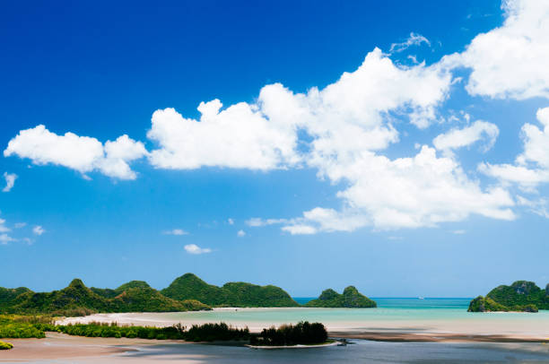Tropical island and tranquil ocean view under summer blue sky of Ao Thung Sang, Chumphon. Thailand