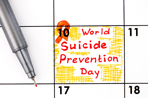 Reminder World Suicide Prevention Day in calendar with pen. September 10.