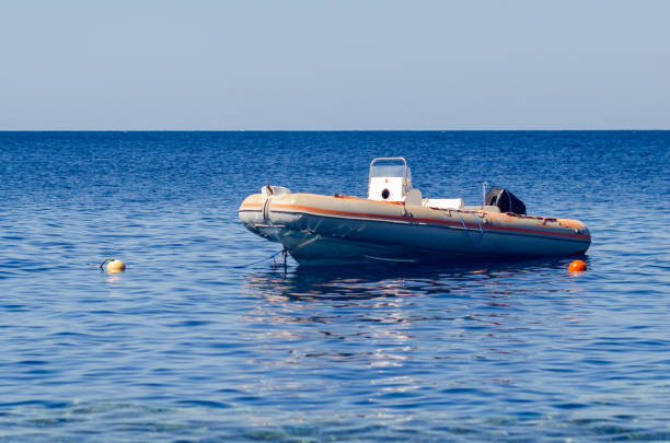 istock Rescue inflatable boat in the blue sea 1270014314