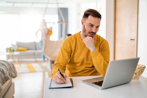 istock Handsome man designer working home using laptop at home 1270014609