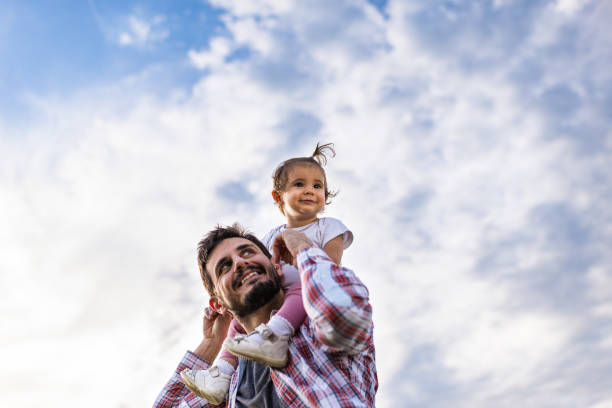 istock Father and daughter exploring nature together 1270016492