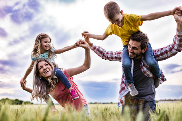 istock Young happy family enjoying nature 1270017933