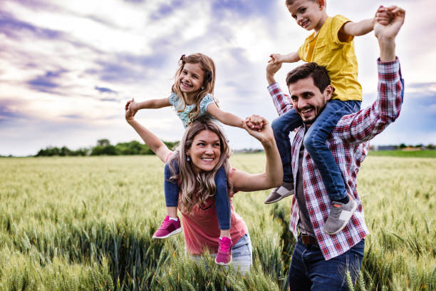istock Young happy family enjoying nature 1270018692