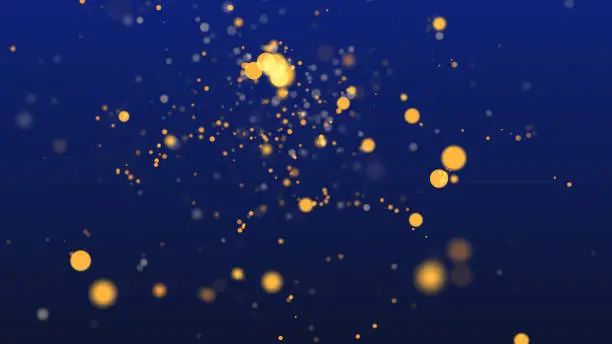 Abstract background with shining gold particles. Shimmering particles with bokeh over blue background.