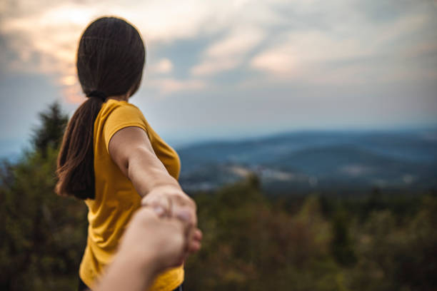 istock Woman holding hand man while leading him 1270020481