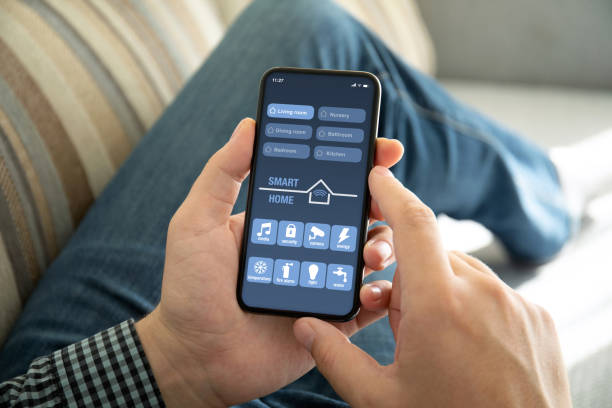 istock male hands holding phone with app smart home on screen 1270021151