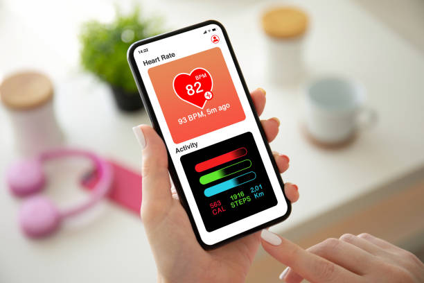 istock female hands holding phone with app heart and activity 1270021298