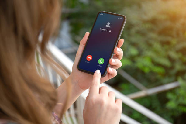 istock female hands holding phone with incoming call on the screen 1270021388