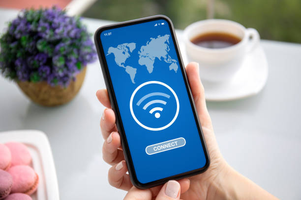 istock female hands holding phone with app wi-fi connect on screen 1270022264
