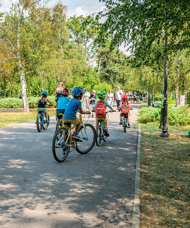 Bucharest/Romania - 08.07.2020: Many children riding bicycles in Herestrau park, Bucharest