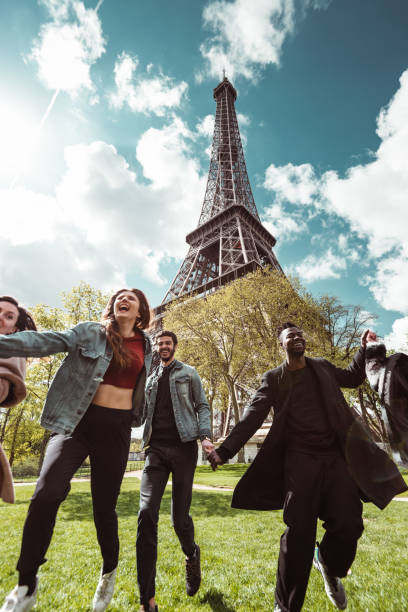 istock happiness student jumping all together in paris 1270022606