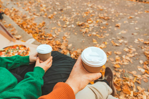 istock couple hands close-up holding mug with coffee to go 1270022608